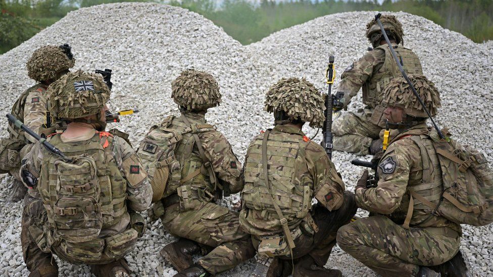 Planned cuts to the British military leave it vulnerable at a time of rising threat, a report from MPs says.