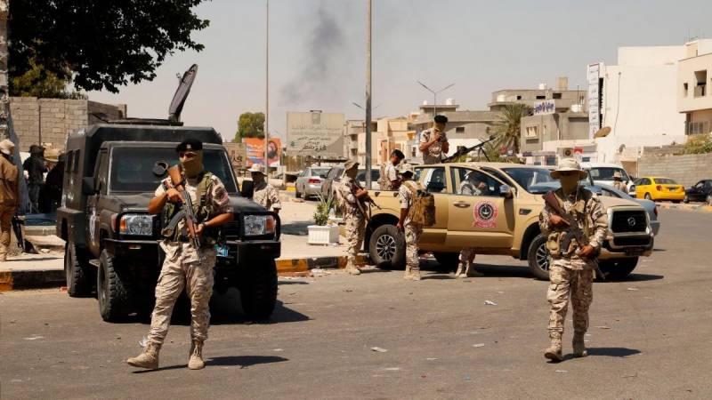 Armed groups clash in Libya capital, killing 13