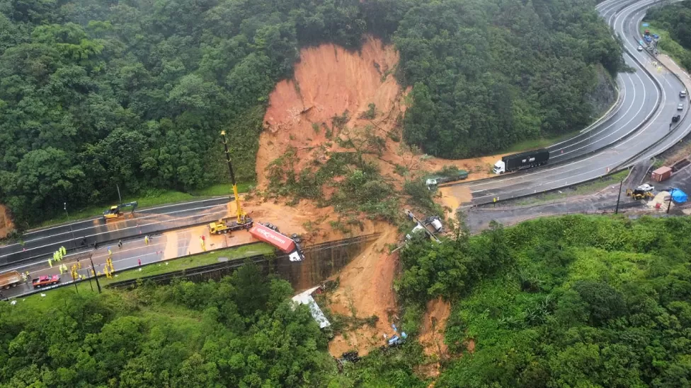 A landslide on a motorway in southern Brazil has killed at least two people and left dozens missing.