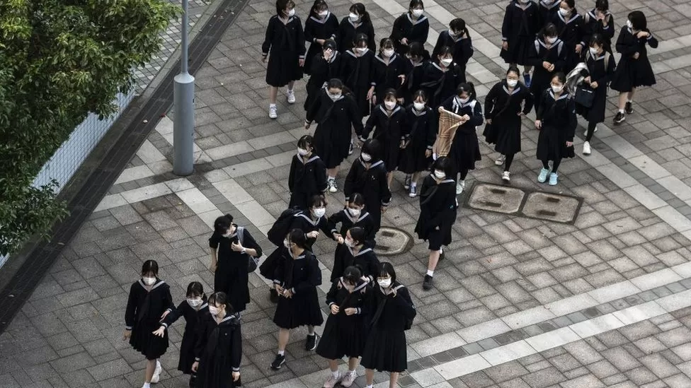 Japanese police are on the hunt for a person who sent bomb and death threats to hundreds of schools, prompting hasty closures.