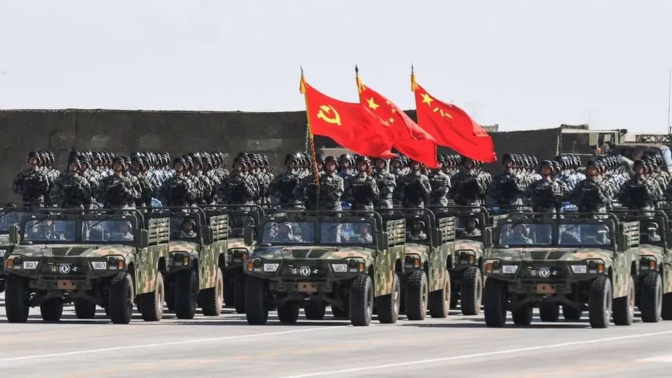 China says it will increase military spending by more than 7% this year, while warning of “escalating” threats.