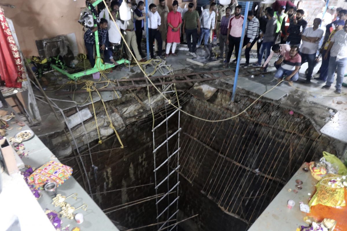 At least 35 people have been killed after falling into a well while offering prayers at a temple in the central Indian state of Madhya Pradesh.