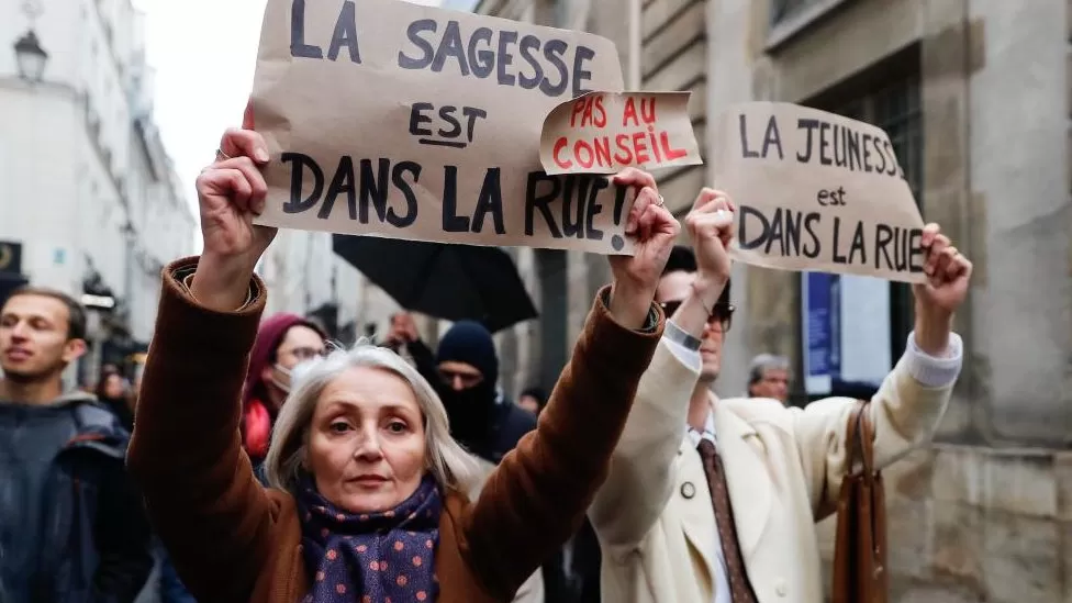 French President Emmanuel Macron has signed into law his government’s highly unpopular pension reforms, which raise the state pension age from 62 to 64.