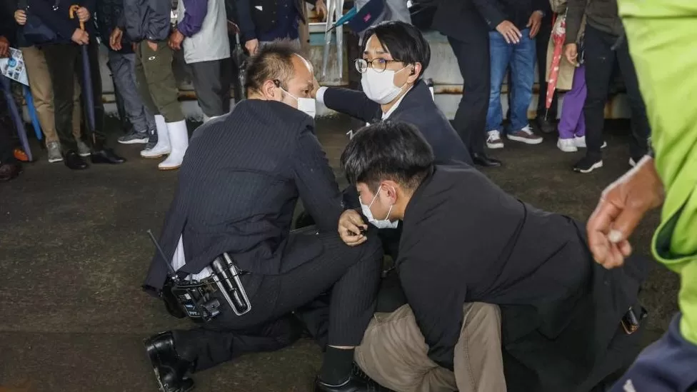 Japan’s Prime Minister Fumio Kishida has been evacuated unharmed from a public event after what appeared to be a smoke bomb was thrown at him.
