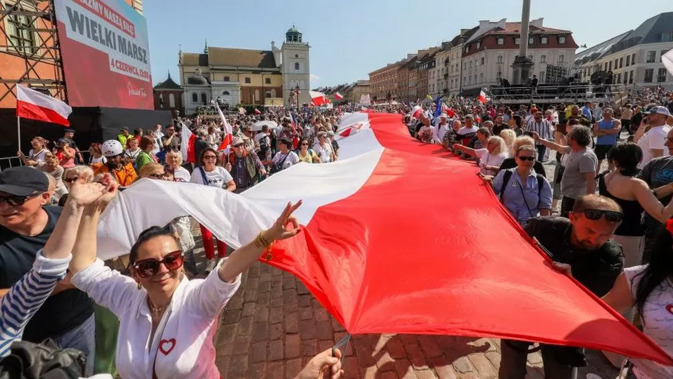Hundreds of thousands of protesters have gathered in Warsaw for one of Poland’s largest demonstrators since the fall of communism in 1989.