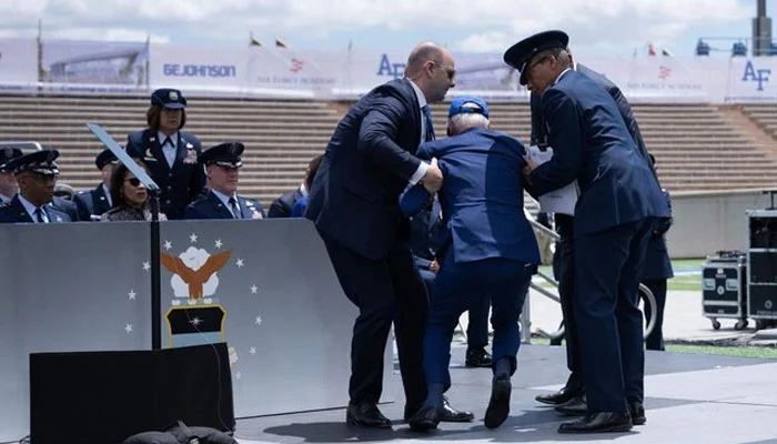 President Biden trips during graduation ceremony but recovers swiftly