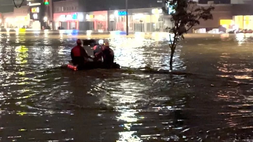 Four people in Canada, including two children, have been reported missing in flooding caused by torrential rains in Nova Scotia, police have said.