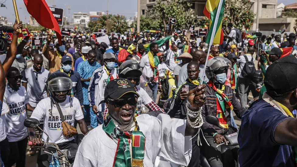 Thousands of demonstrators have gathered in Senegal’s capital, Dakar, demanding swift presidential elections.