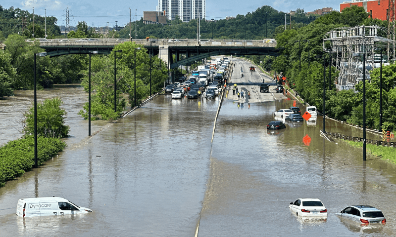 Torrential rains flood Toronto, causing power outages, traffic disruption