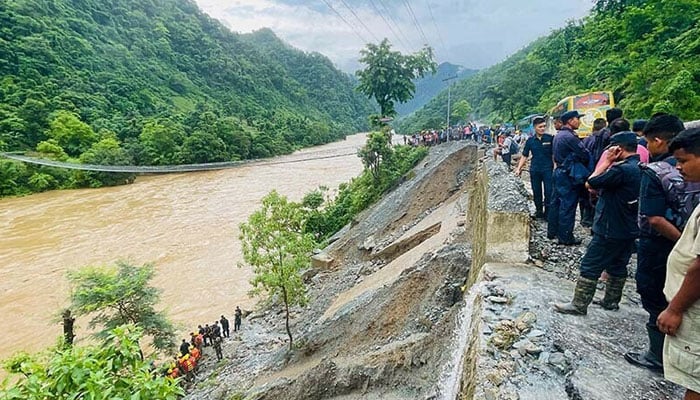 At least 63 missing after Nepal landslide sweeps two buses into river